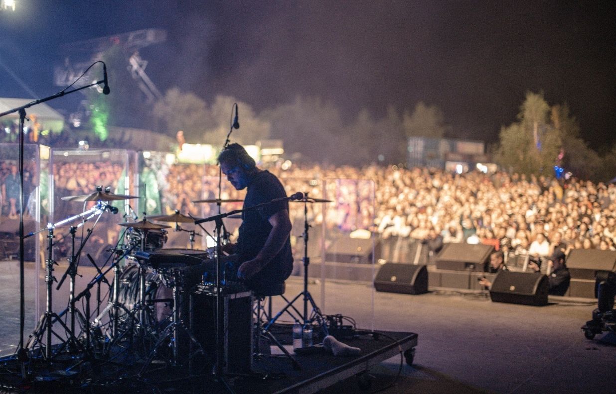 Anthony drumming live with a massive crowd
